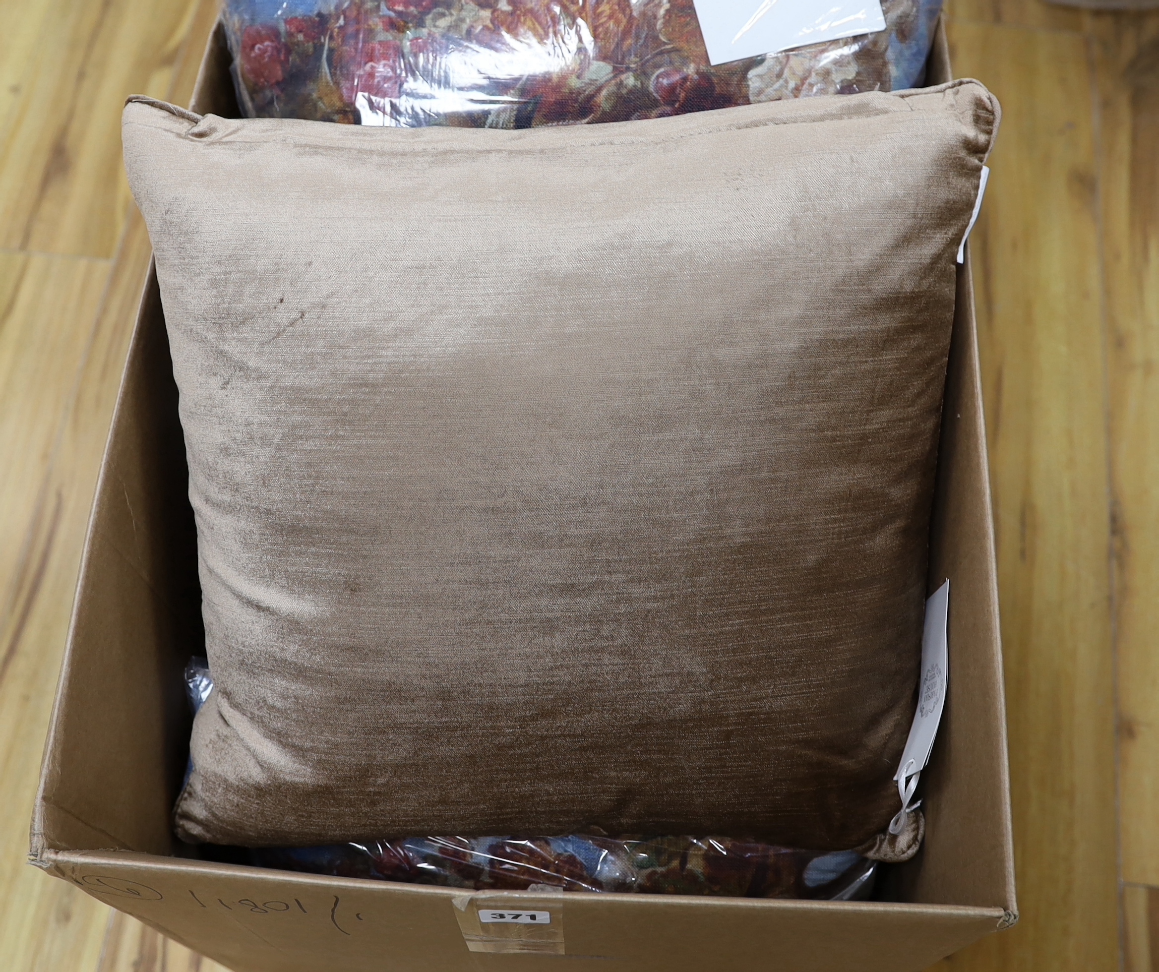 A set of six printed cushions depicting a still life scene of fruit, flowers and leaves